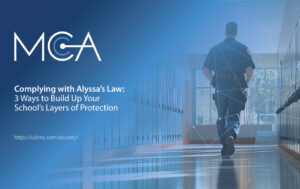 a security officer roams the hall of a school complying with Alyssa’s Law - that mandates silent panic alarms in public elementary and secondary schools - that directly notifies law enforcement during emergencies