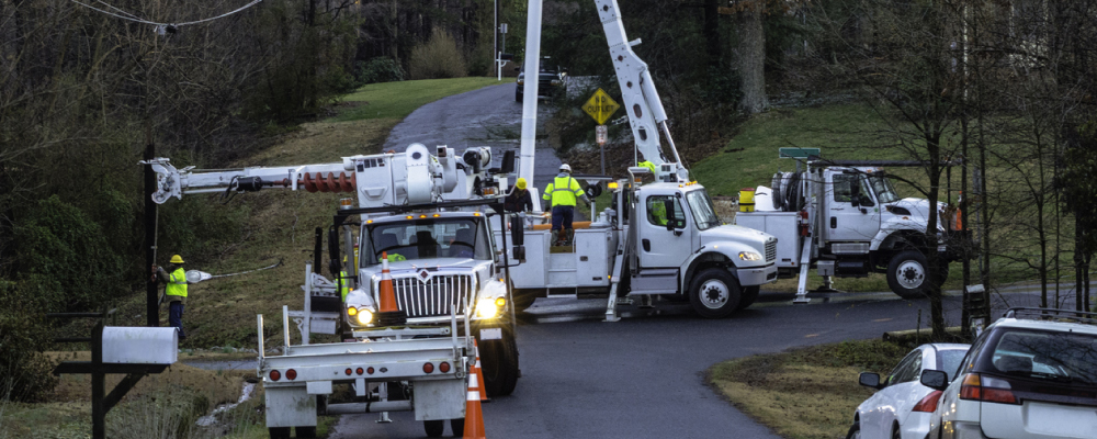 Utility Trucks and Field Teams Working to Repair Lines and Restore Power