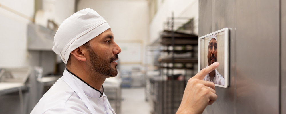 access control helping reduce time theft as a cook is on premise signing in