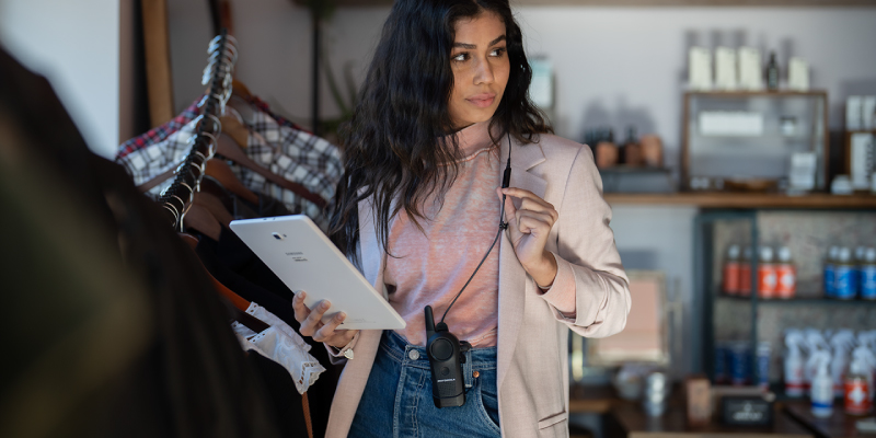 Retail Worker Using the Motorola Curve Two Way Radio