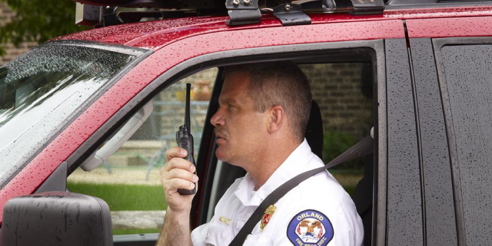 APX 6000 Two Way Radio in FIre Chiefs Hand