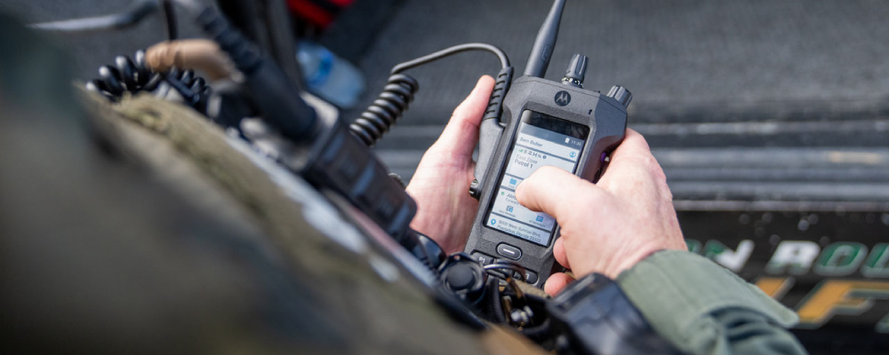 SWAT Officer using an APX N70 Radio