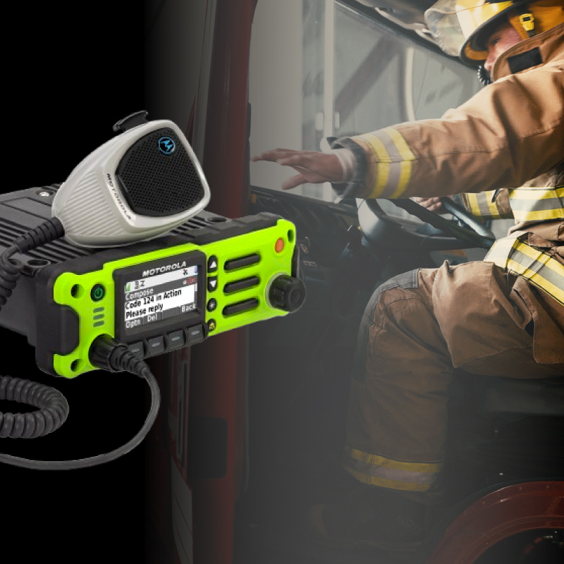 APX 4500 Mobile Two Way Radio Superimposed Over a Fire Truck