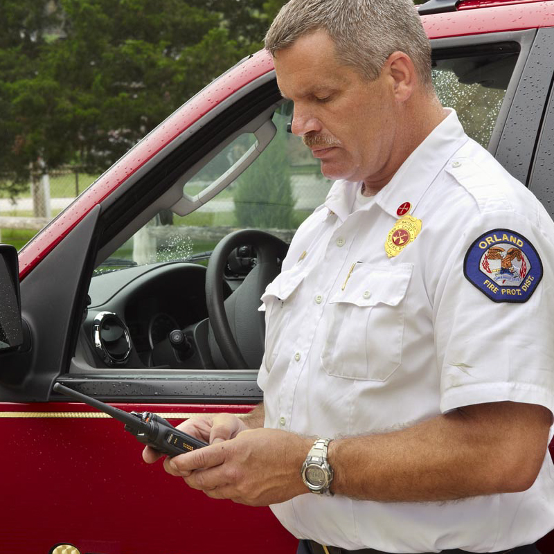 APX 6000 Two Way Radio in Fire Commanders Hands