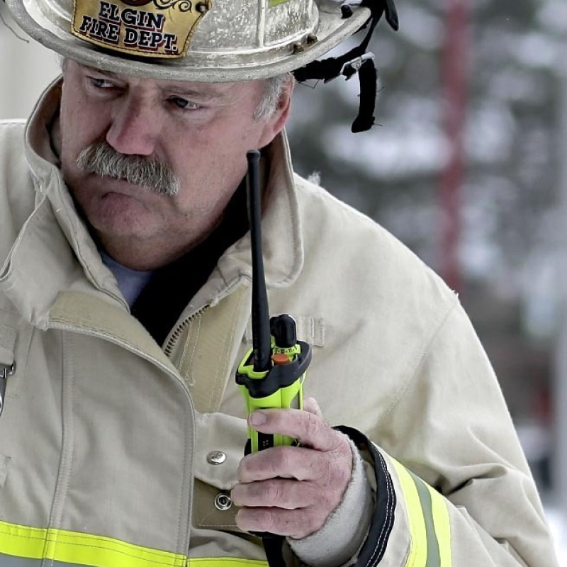 Fire Chief Holding Motorola APX 8000XE Radio