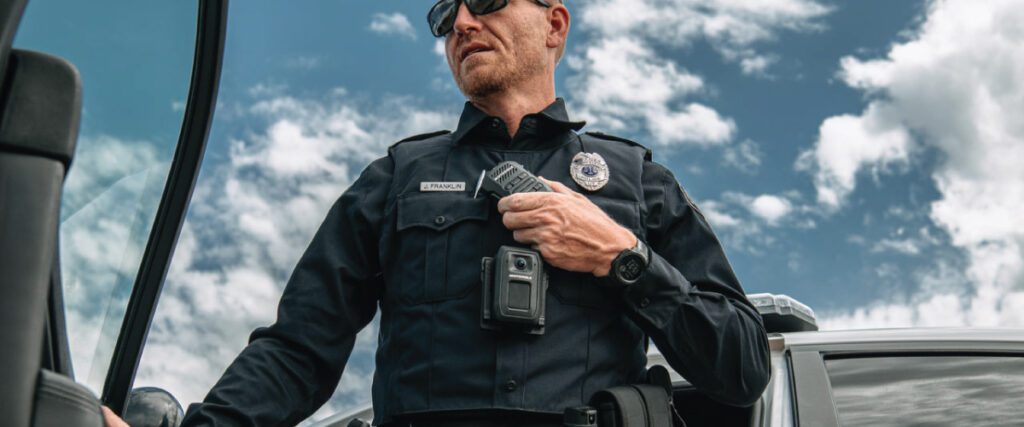 Police Officer Wearing a V700 Body Camera and Using a Motorola Speaker Microphone