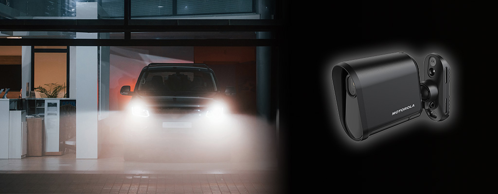 Motorola L6Q license plate recognition camera keeping watch over an hospital's emergency room entrance as a car pulls up late at night.