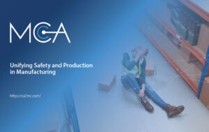 A warehouse worker lays hurt, and alone, on the floor holding their head and leg.