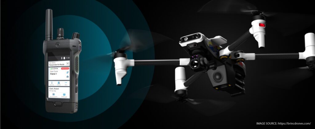 Motorola's APX NEXT smart radio next to a BRINC drone to symbolize the BRINC-Motorola Solutions alliance.