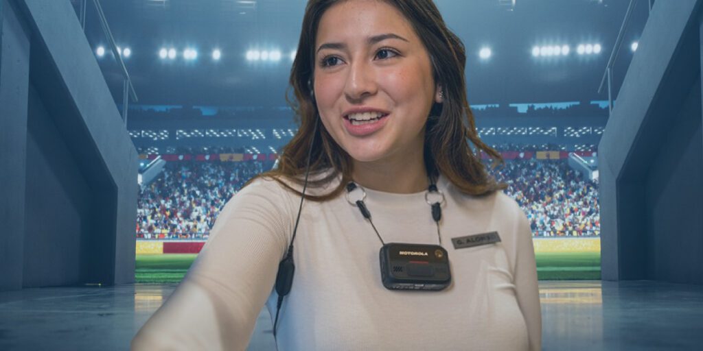 A stadium employee wears the Motorola VB400 body camera while standing in a corridor that leads to the stadium field.