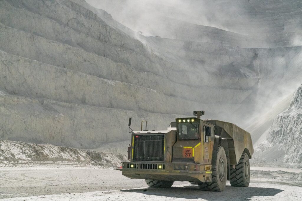 Mining machinery truck at the bottom of a quarry.