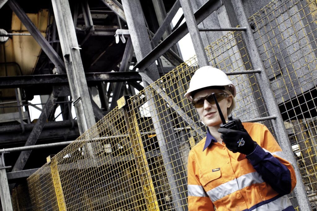 A mining worker investigating a sensitive area.