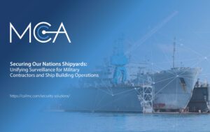 A military ship docked in a shipyard.