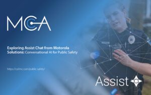 A police officer using a two-way radio equipped with Motorola Solutions' Assist Chat.