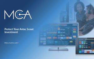 Avtec Scout system running on a desktop and tablet with two workers using the Avtec Scout system in the background.