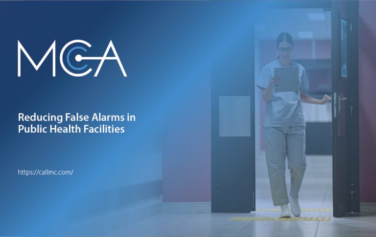 A hospital worker walks through an access controlled door while reading a patient's chart.